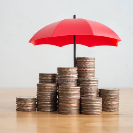 stacks of coins under an umbrella