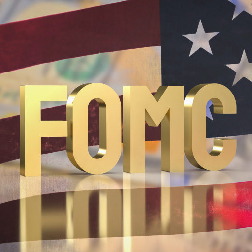 FOMC in block letters in front of an American flag.