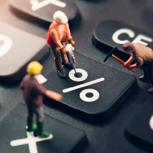 Toy construction men doing work on the % key of a calculator – the image is meant to represent businesses working for a better interest rate during a low rate environment